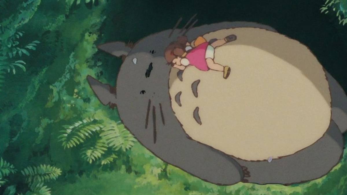 Little girl sleeping on Totoro. 