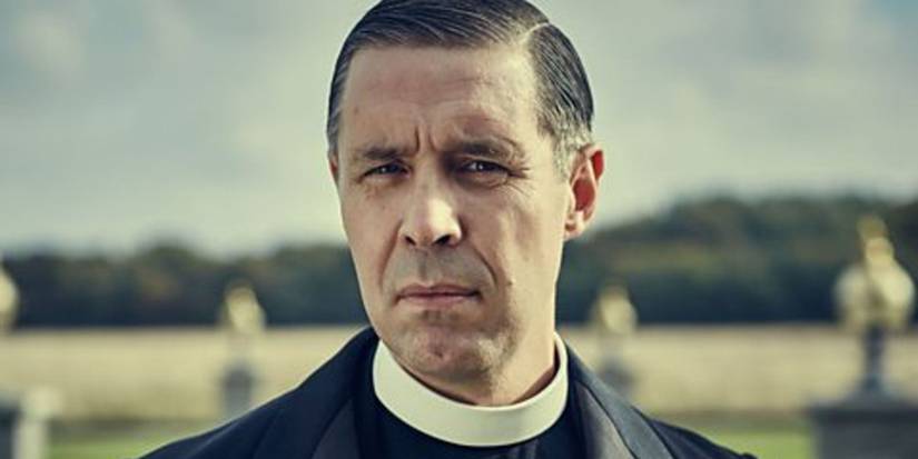 The character Father Hughes from Peaky Blinder.
