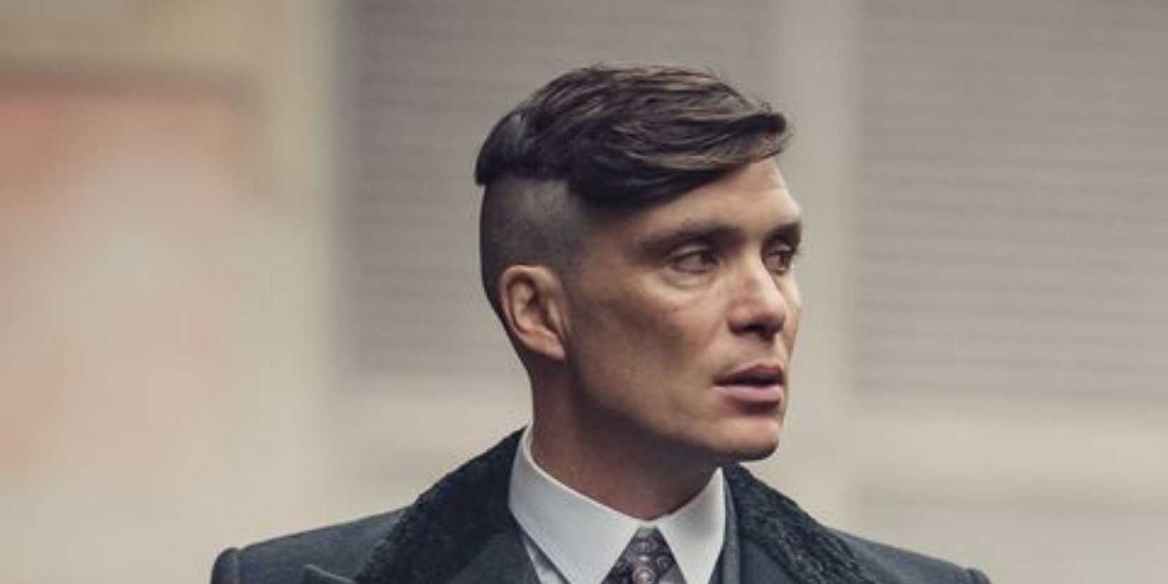 Tommy Shelby from Peaky Blinders standing.
