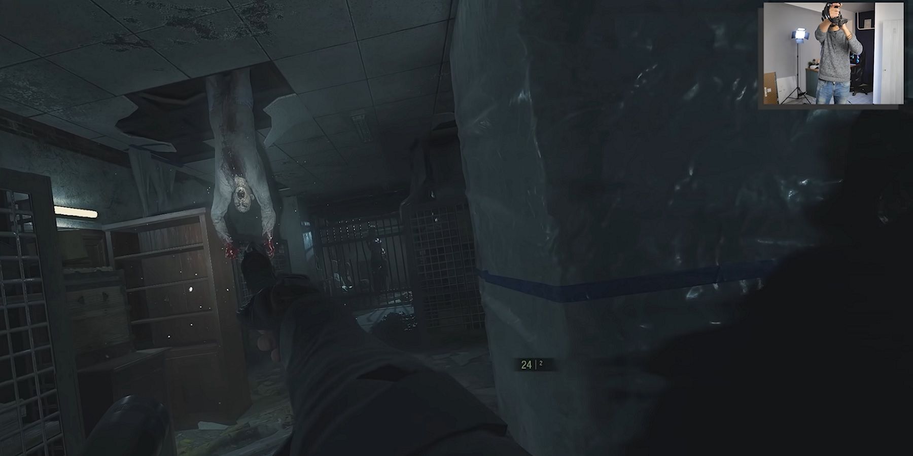 Screenshot from Resident Evil 2 VR showing the person playing in the corner of the screen.
