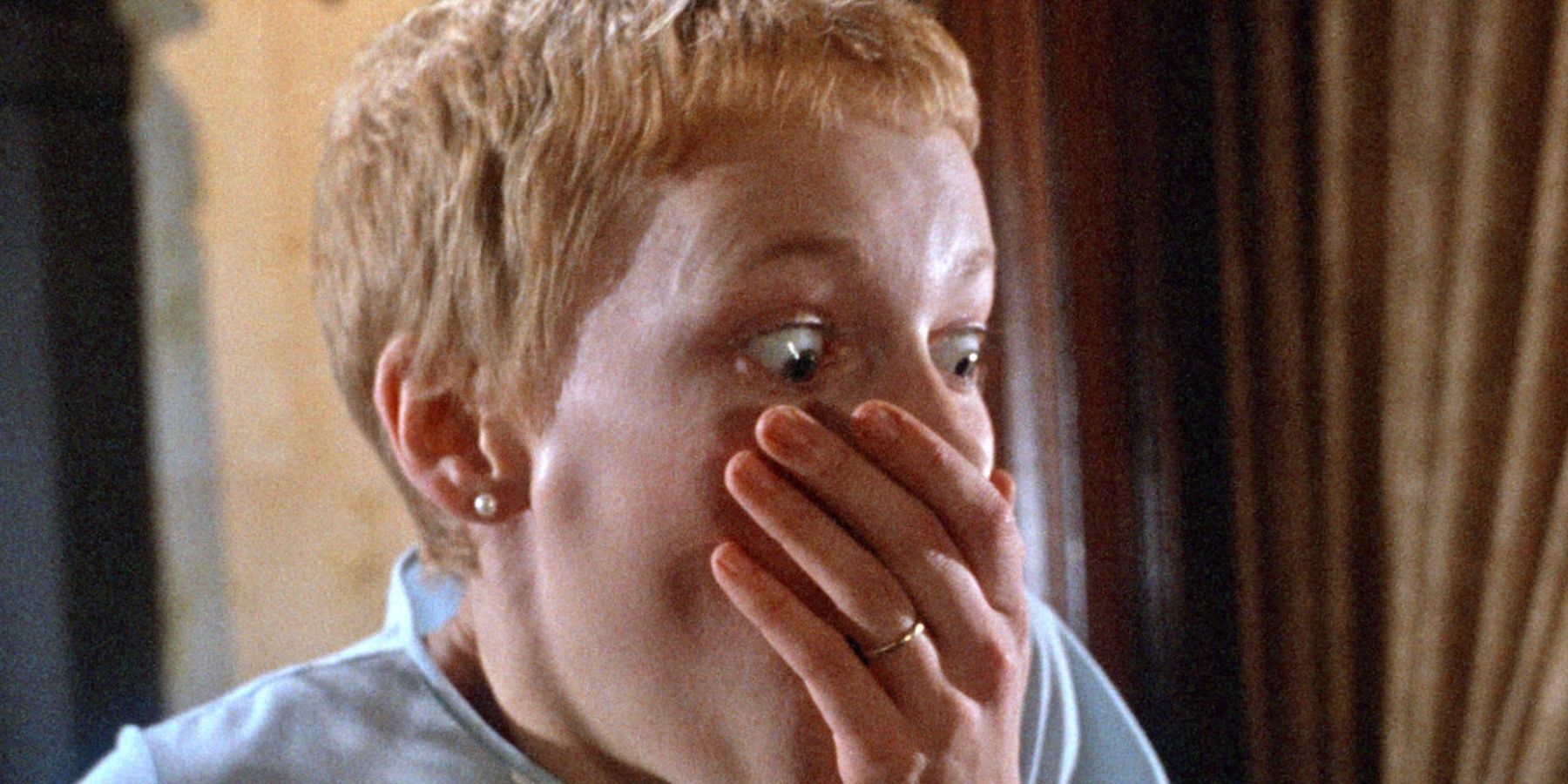 Mia Farrow holding her hand over her mouth in Rosemary's Baby