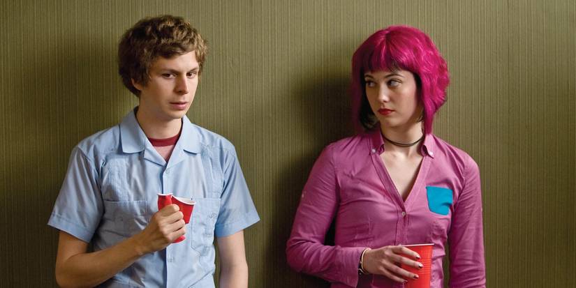 Scott Pilgrim standing next to a lightly judging Ramona Flowers in Scott Pilgrim vs the World