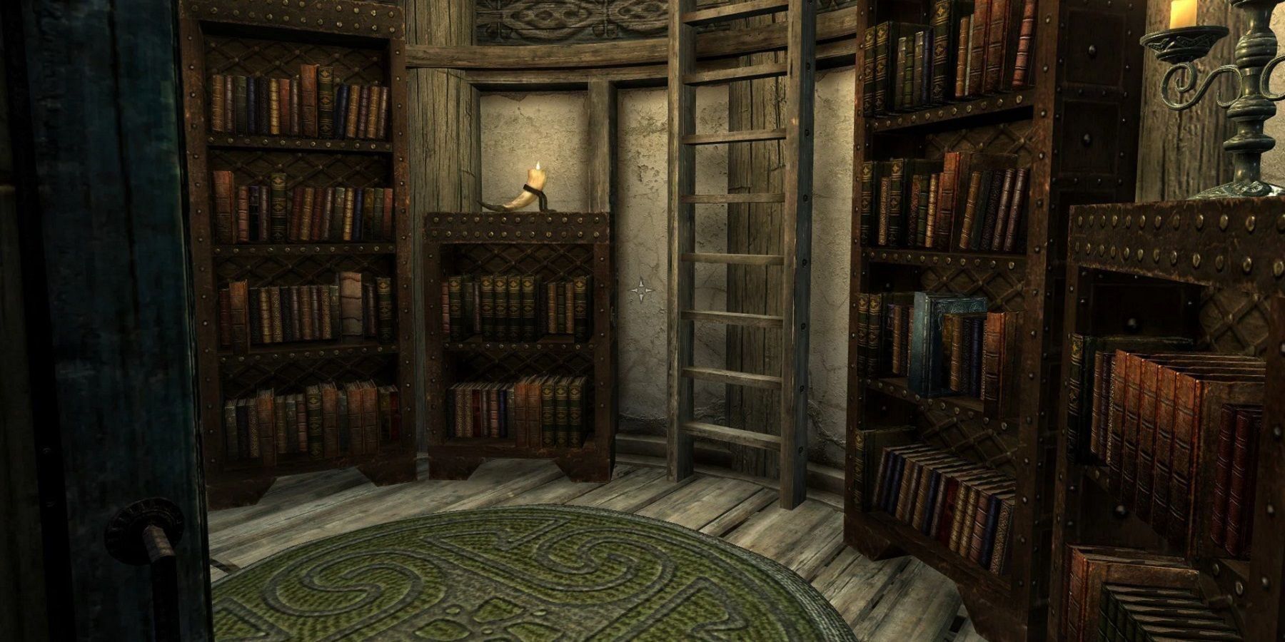 An image from The Elder Scrolls 5: Skryim showing a room with bookcases all full of books.