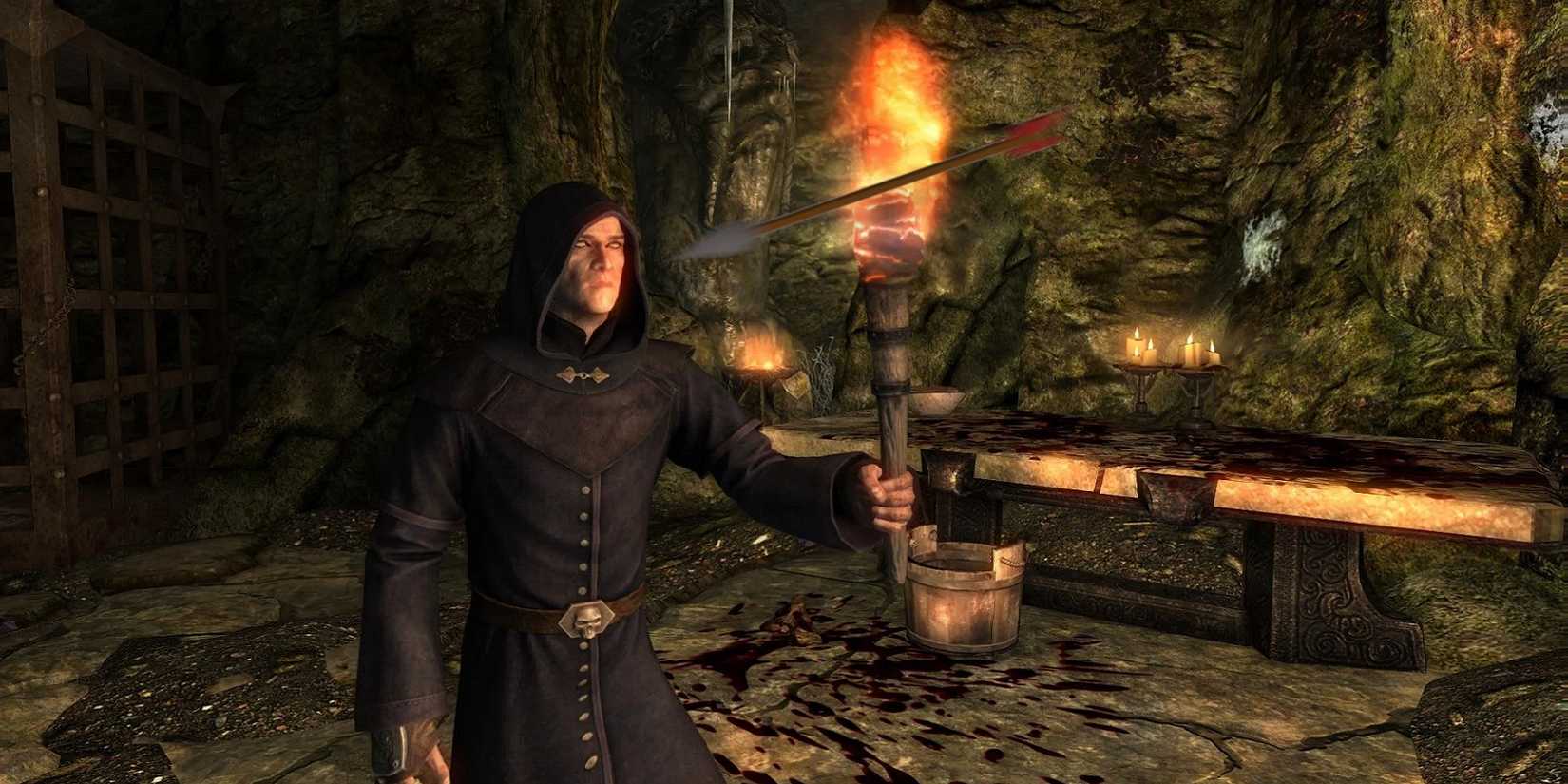 Image from Skyrim showing a necromancer holding a lit torch as an arrow flies towards their face.