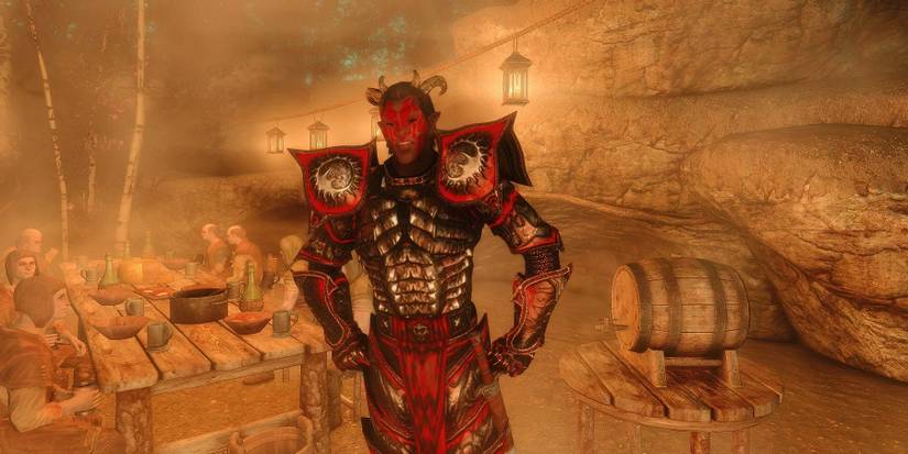 Screenshot from The Elder Scrolls 5: Skyrim showing the Daedra character Sanguine in a well-lit cave.