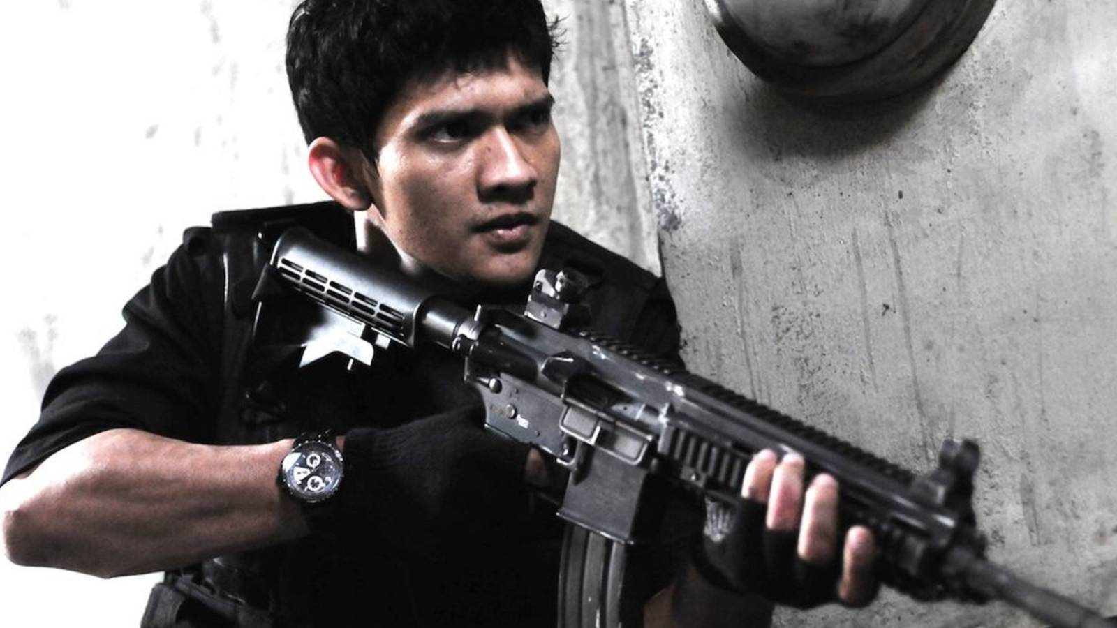 the raid redemption close up with automatic gun