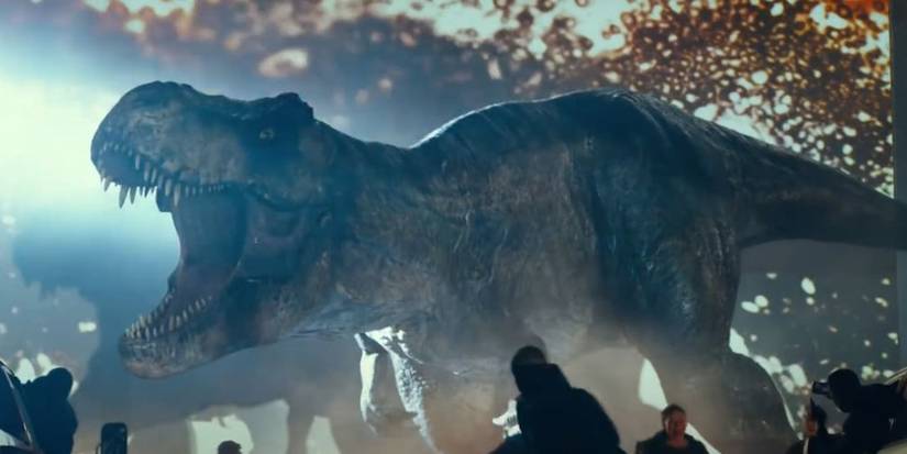 Image of a  Tyrannosaurus rex attacking movie goers in Jurassic World: Dominion.