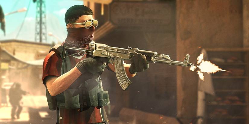 Insurgency Sandstorm image of soldier firing silver AKM assault rifle in a city
