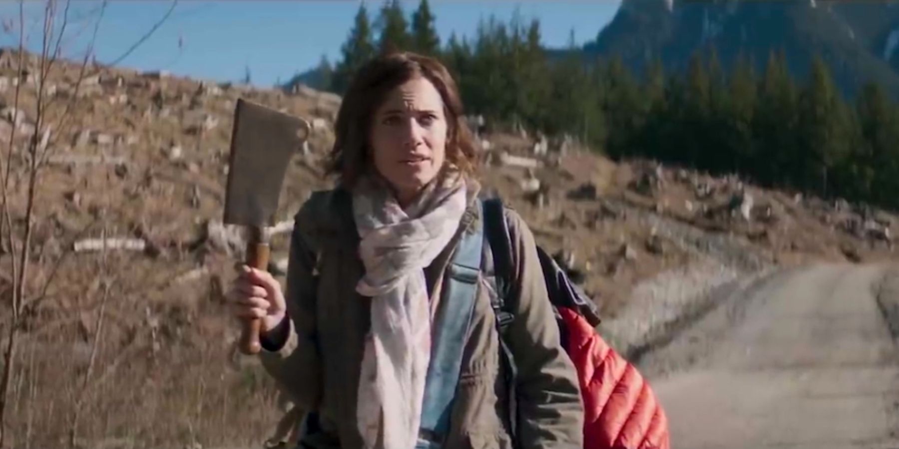 Allison Williams holding up a meat cleaver In The Perfection