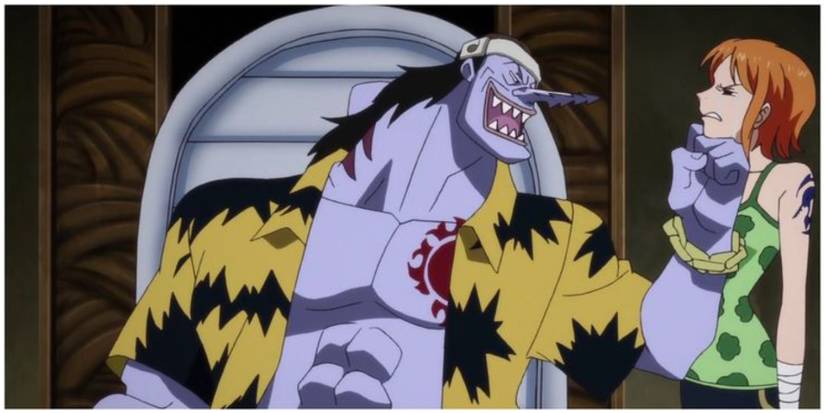 Arlong taunting Nami about freeing her village in One Piece
