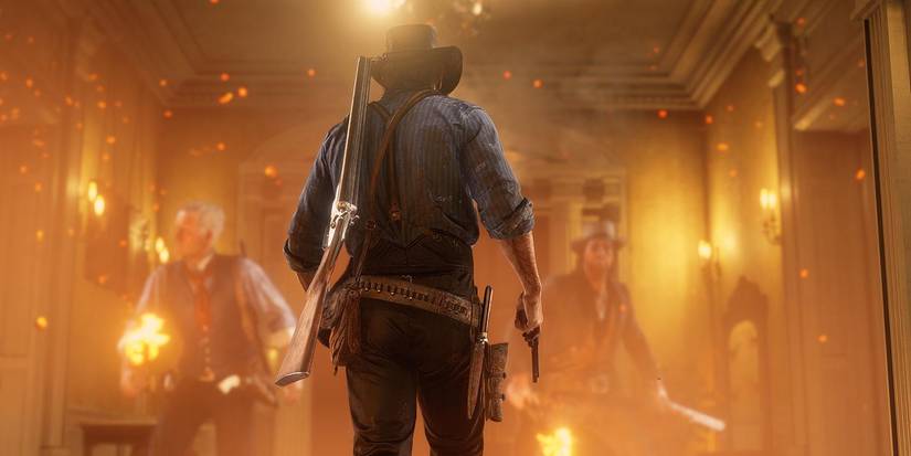 Red Dead Redemption 2 Arthur Morgan walking into fire in Braithwaite Manor