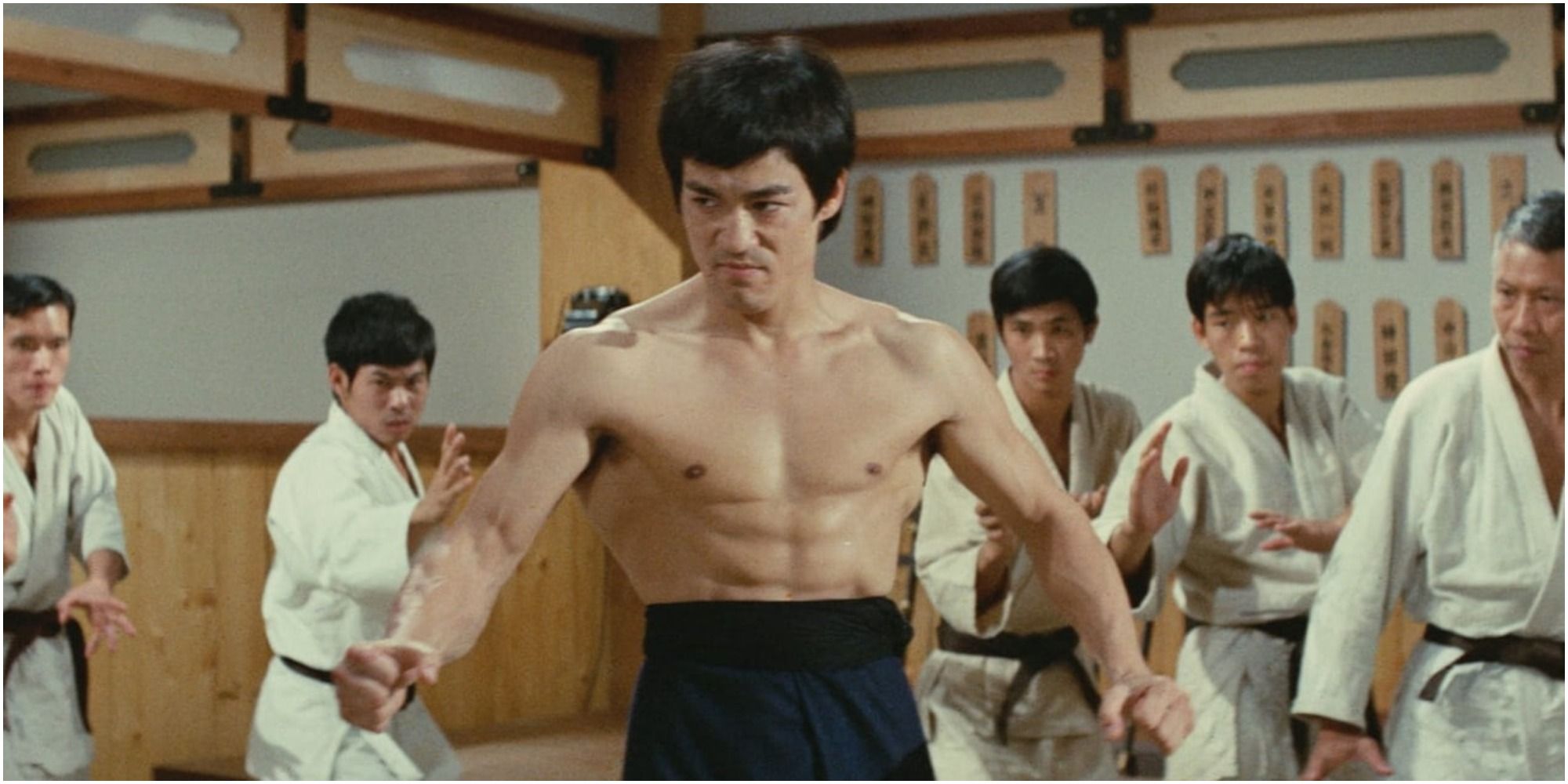 Bruce Lee surrounded in a Karate dojo in Fist of Fury
