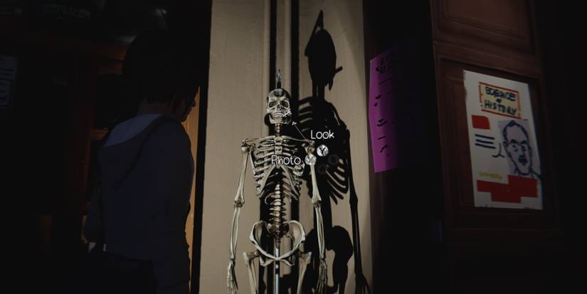 Max looking at a skeleton with a ciggarette in it's mouth in the science classroom, during Episode 3 of Life is Strange Remastered