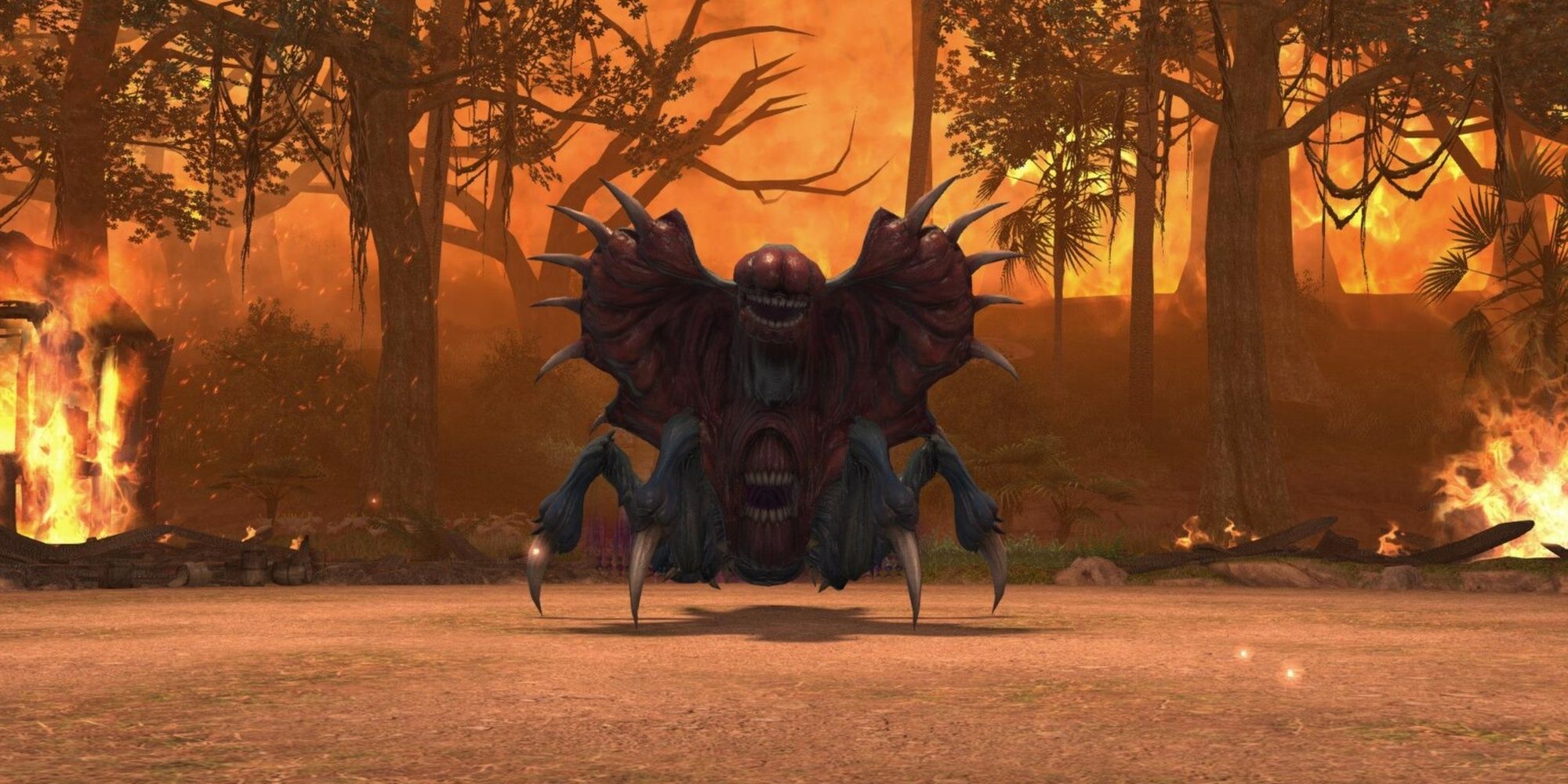 The Vanaspati dungeon from Final Fantasy 14: Endwalker. A spiderlike beast covered in spikes and mouths stands in a clearing in a burning rainforest.