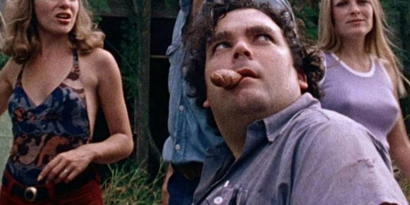 Franklin and his friends stand outside Leatherface's home in The Texas Chain Saw Massacre 1974