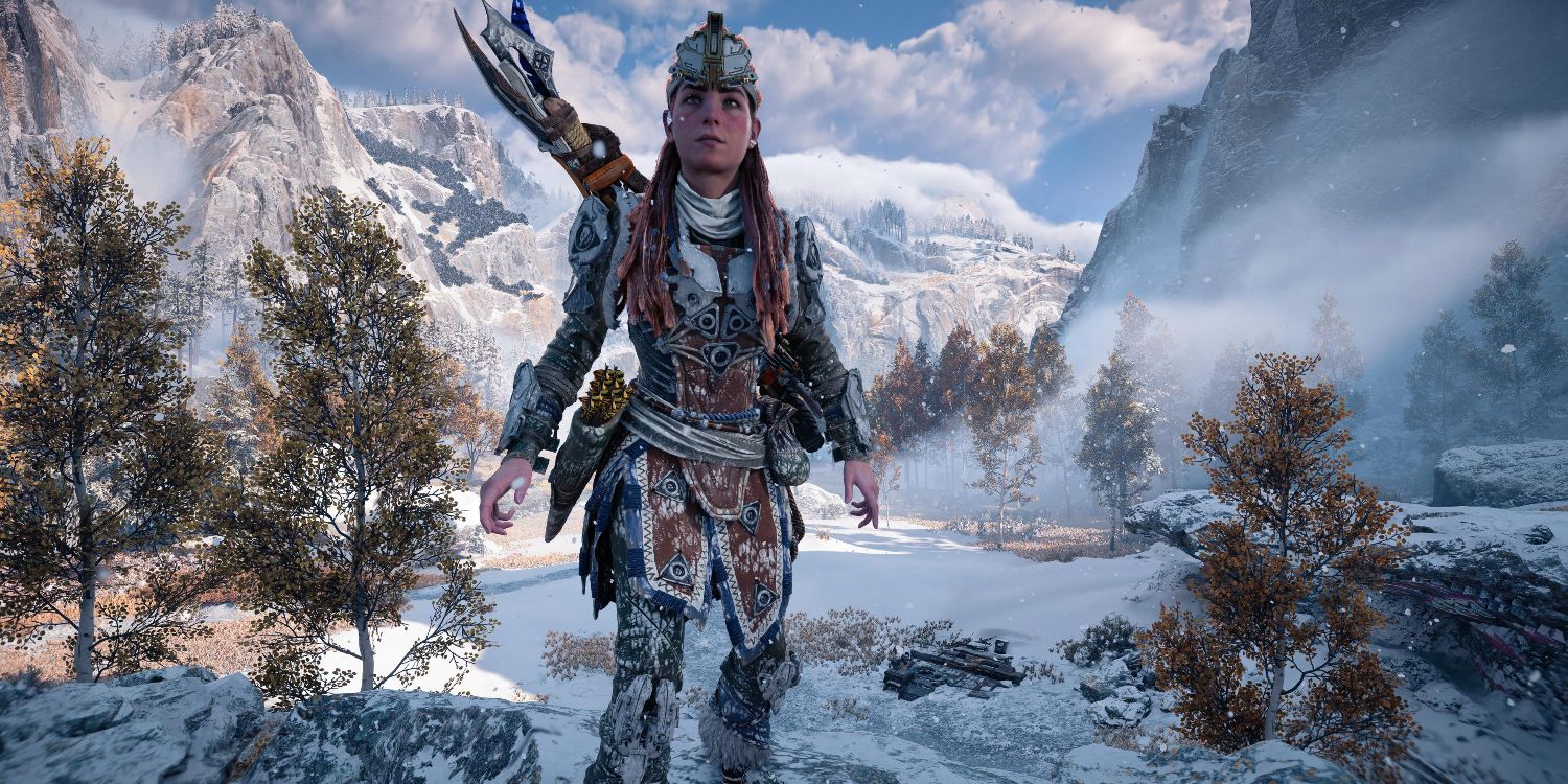 aloy in an armor-plated outfit standing in a snowy valley with mountains stretching into the background