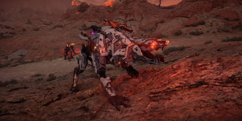 a tiger like machine with glowing red eyes standing on a rocky hill