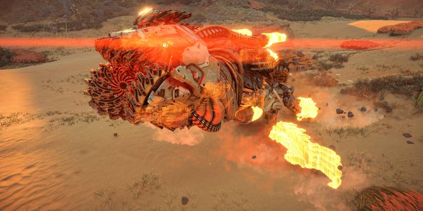 a machine with glowing red eyes and a mouth filled with sharp, churning motors