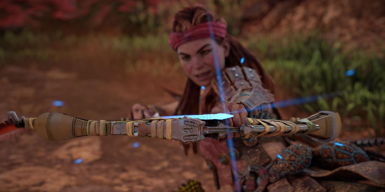 aloy sliding on the ground while knocking an arrow that's glowing blue