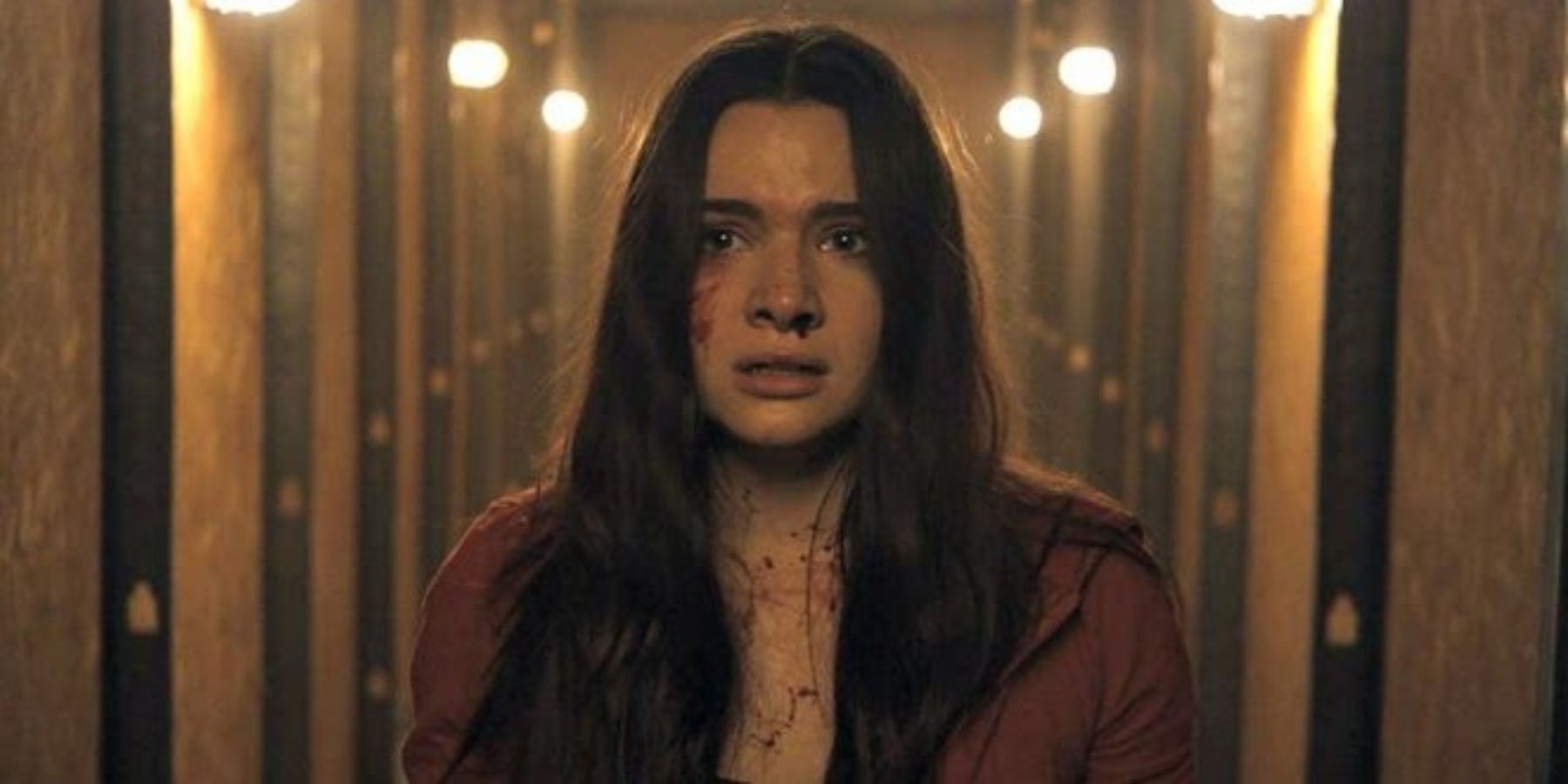 Katie Stevens looking scared as Harper in 2019 horror movie Haunt