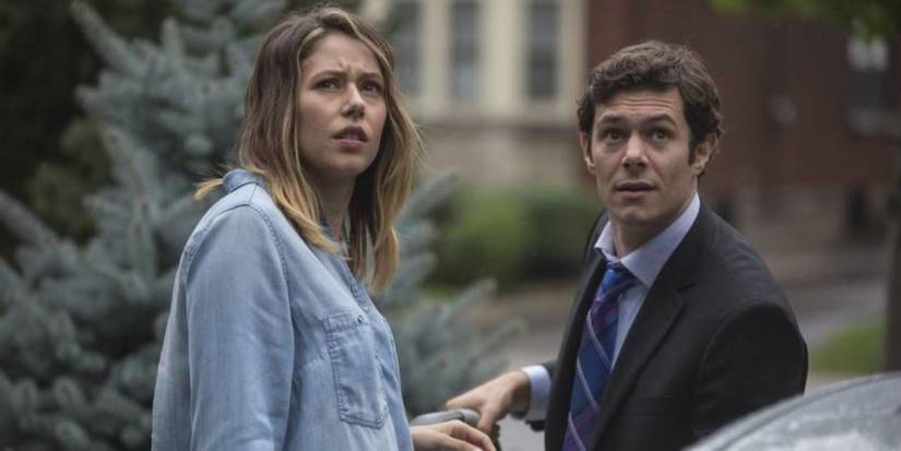 Amanda Crew and Adam Brody standing outside in Isabelle