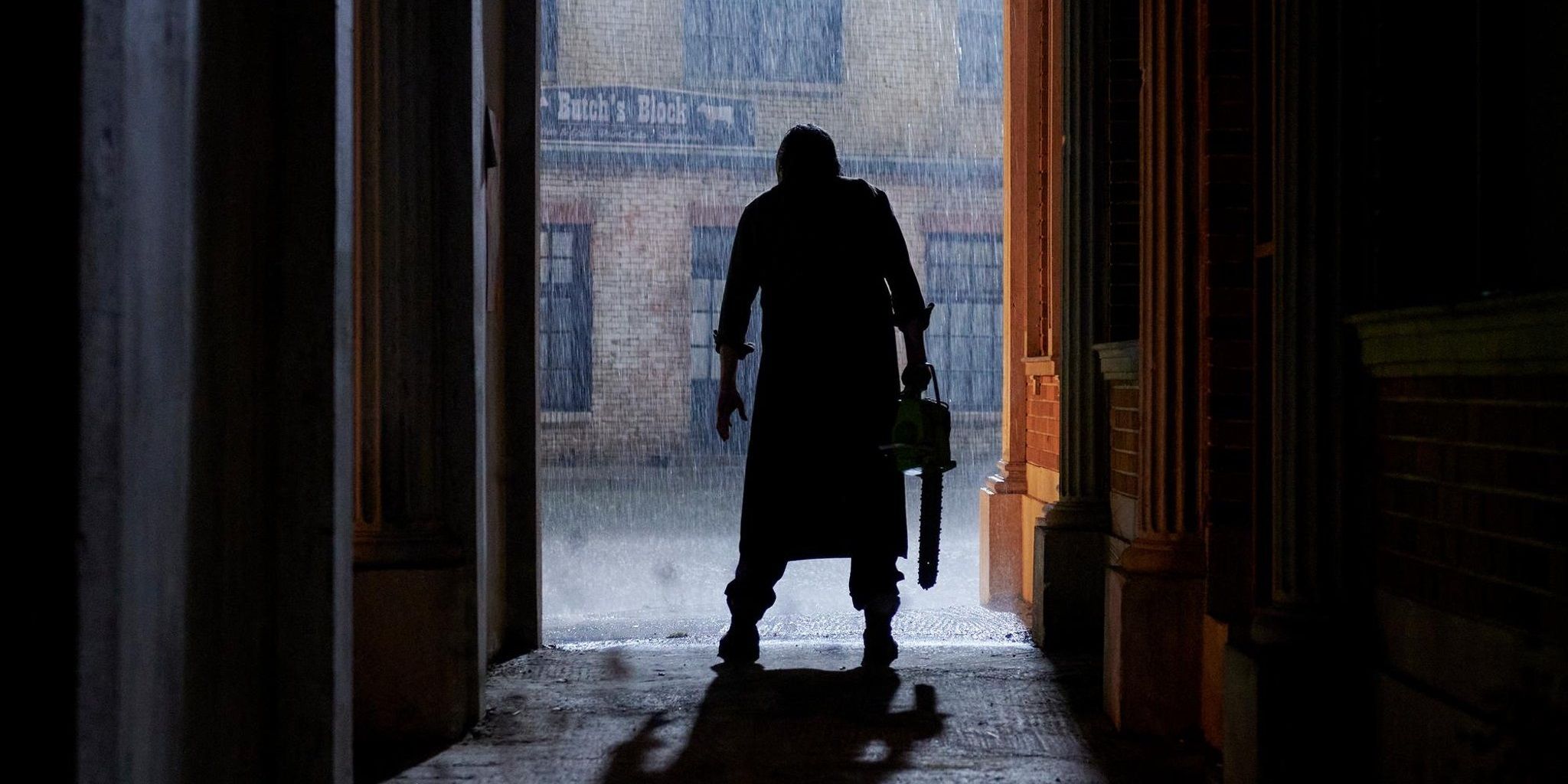 Leatherface standing in the rain in Texas Chainsaw Massacre 2022