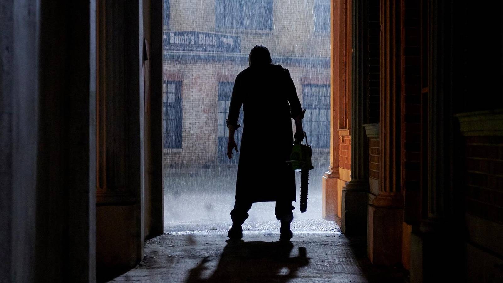 Leatherface standing in the rain in Texas Chainsaw Massacre 2022