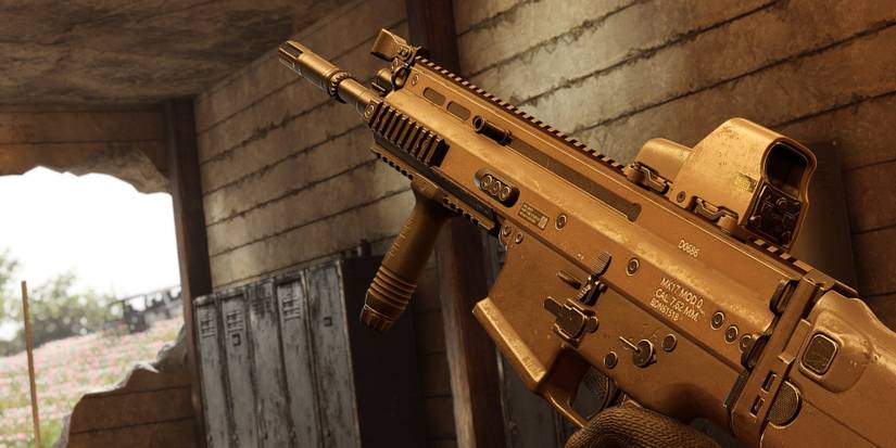 Insurgency Sandstorm first person image of tan MK17 SCAR-H battle rifle inside ruined building