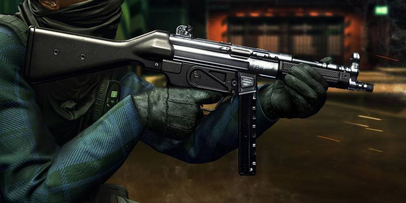 Insurgency Sandstorm close up image of soldier holding gray MP5A2 submachine gun