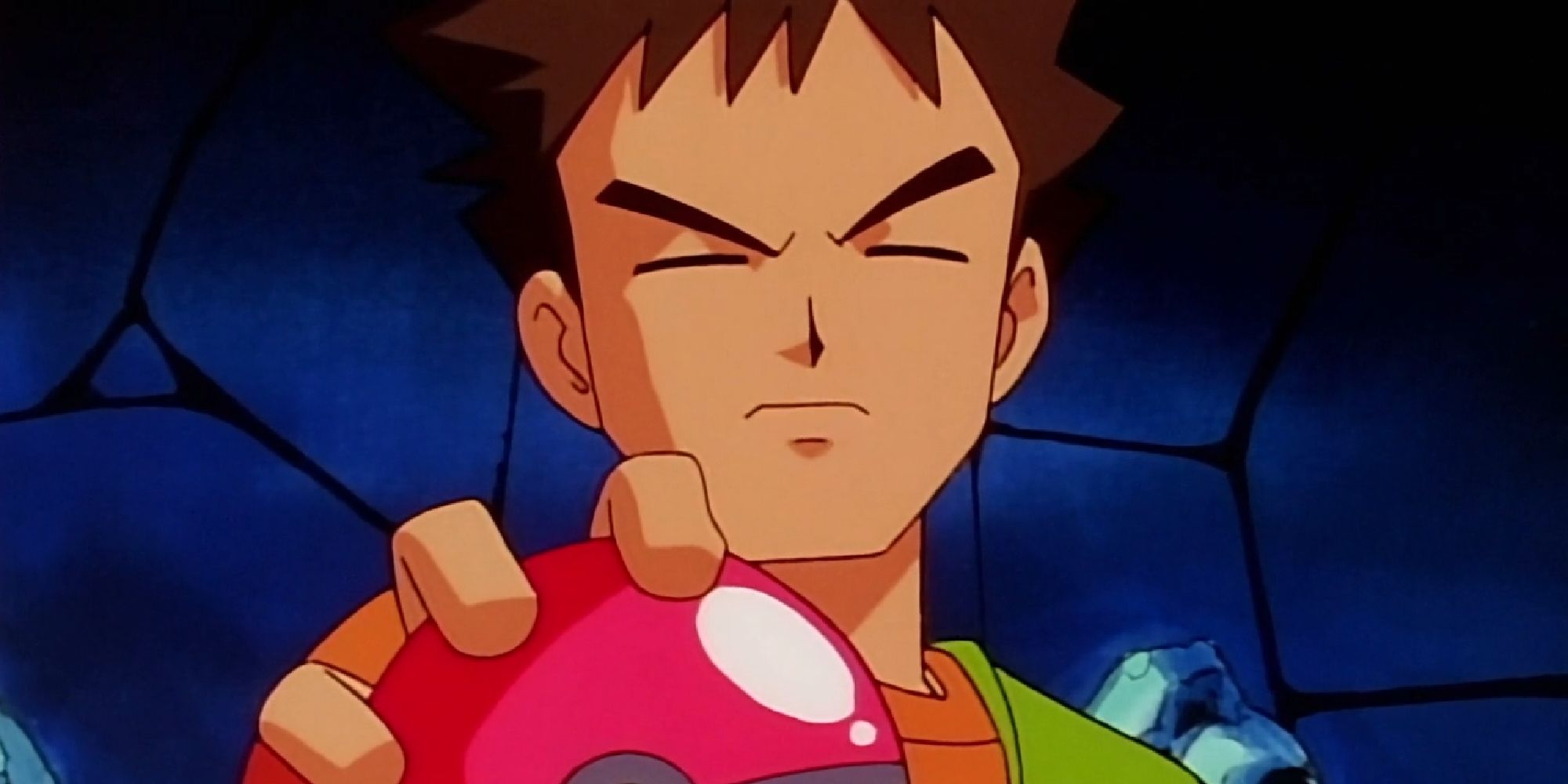 Brock holding out a Poke Ball during his gym battle with Ash