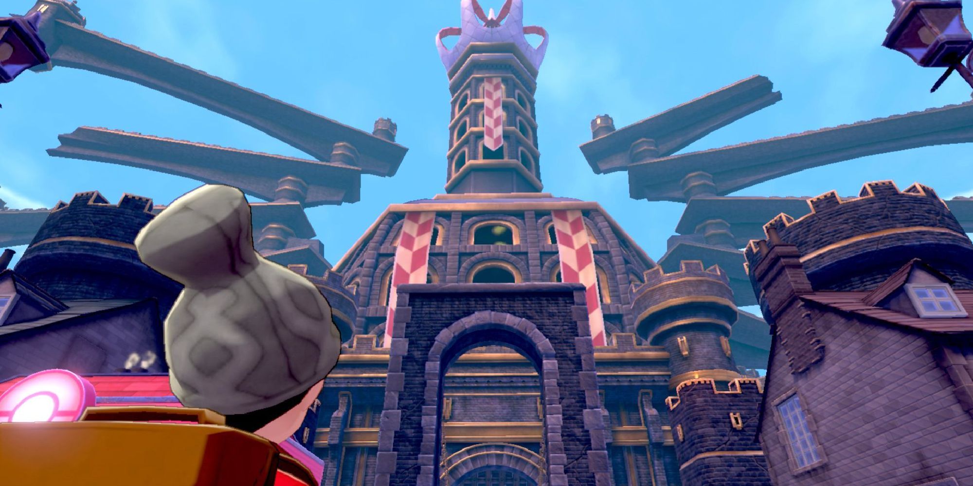 A player looking up at Hammerlocke castle in Pokemon Sword & Shield