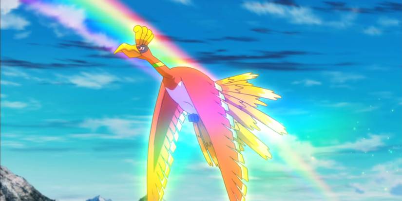 Ho-Oh flying in the sky past a rainbow in the anime