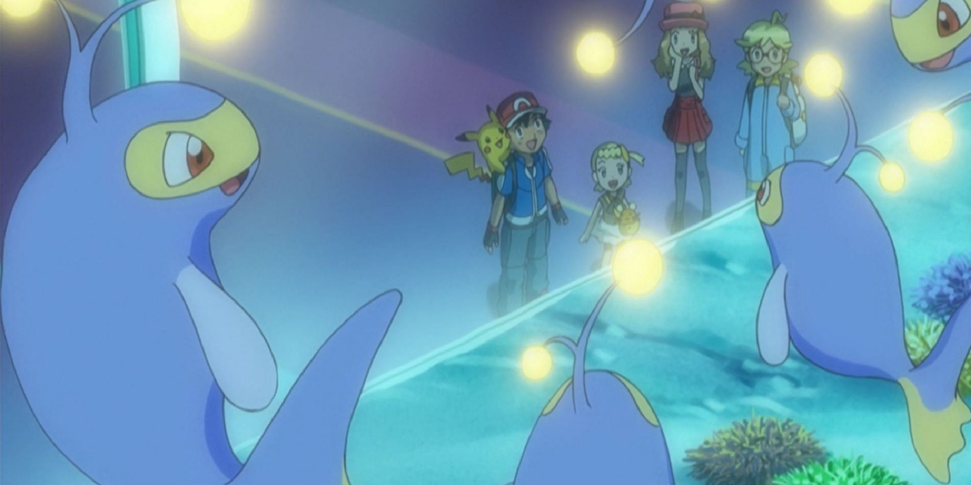 Ash, Pikachu, Serena, Clemont, and Bonnie admiring an aquarium filled with Lanterns