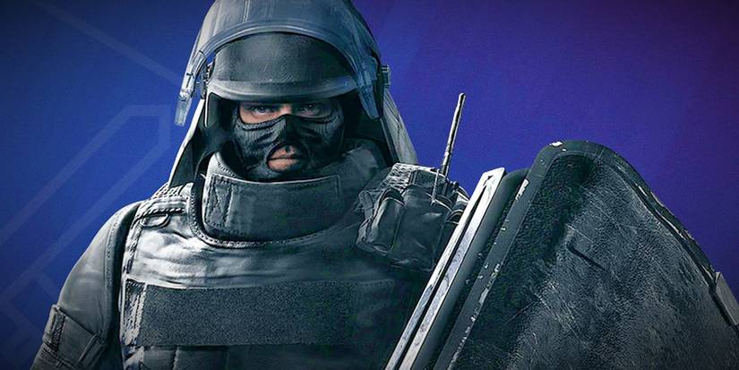 Rainbow Six Siege French operator Montagne wearing heavy armor and holding black collapsible shield