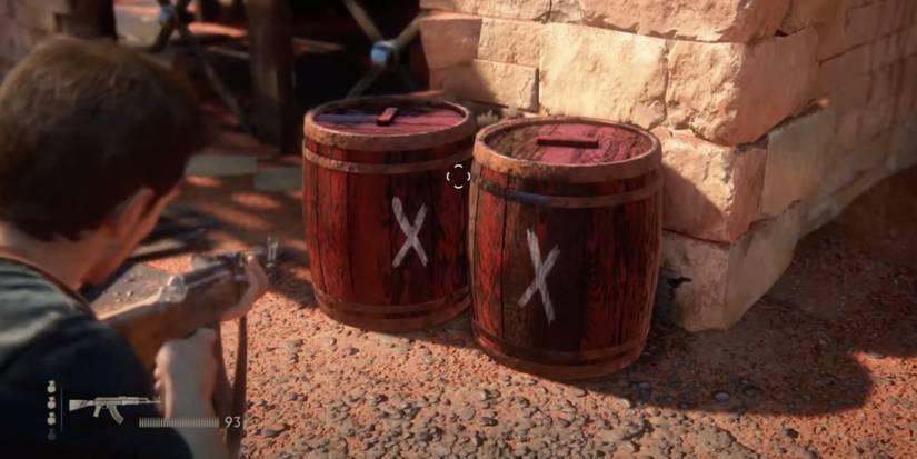 Nathan Drake Aiming at red barrels Uncharted 4