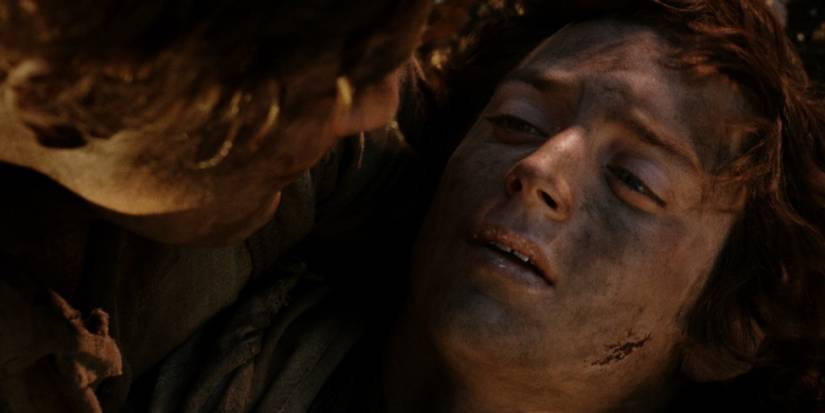 Samwise holding a weak Frodo in his arms in Return of the King