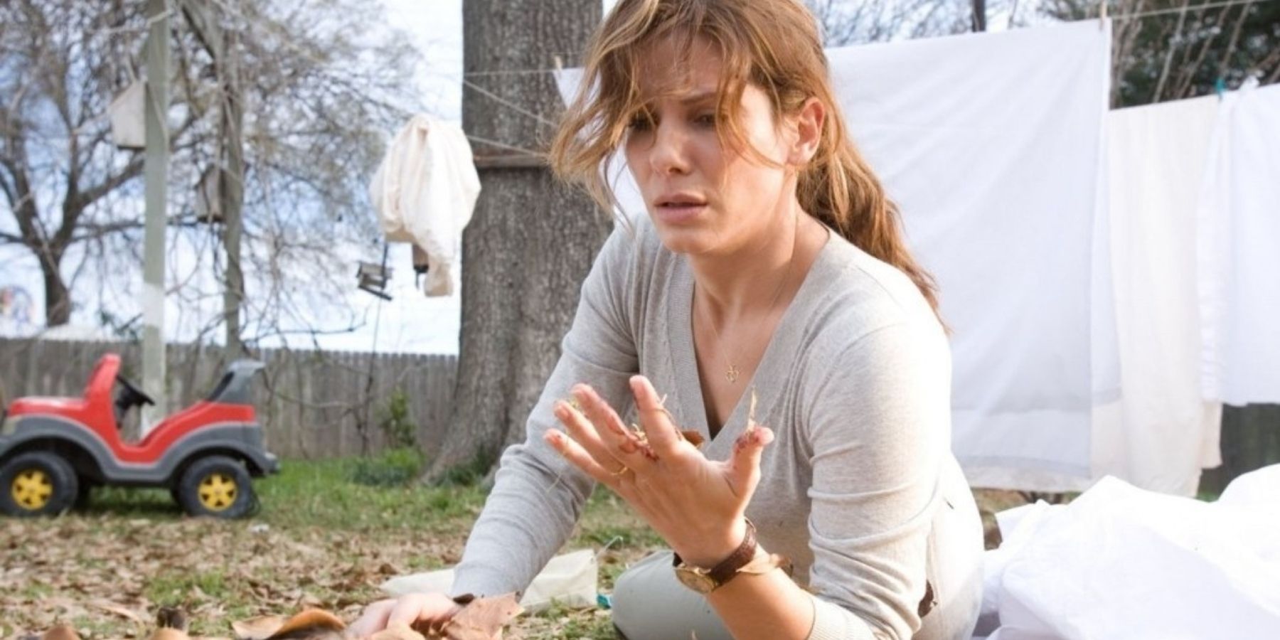 Sandra Bullock looking confused outside in Premonition Featured Image