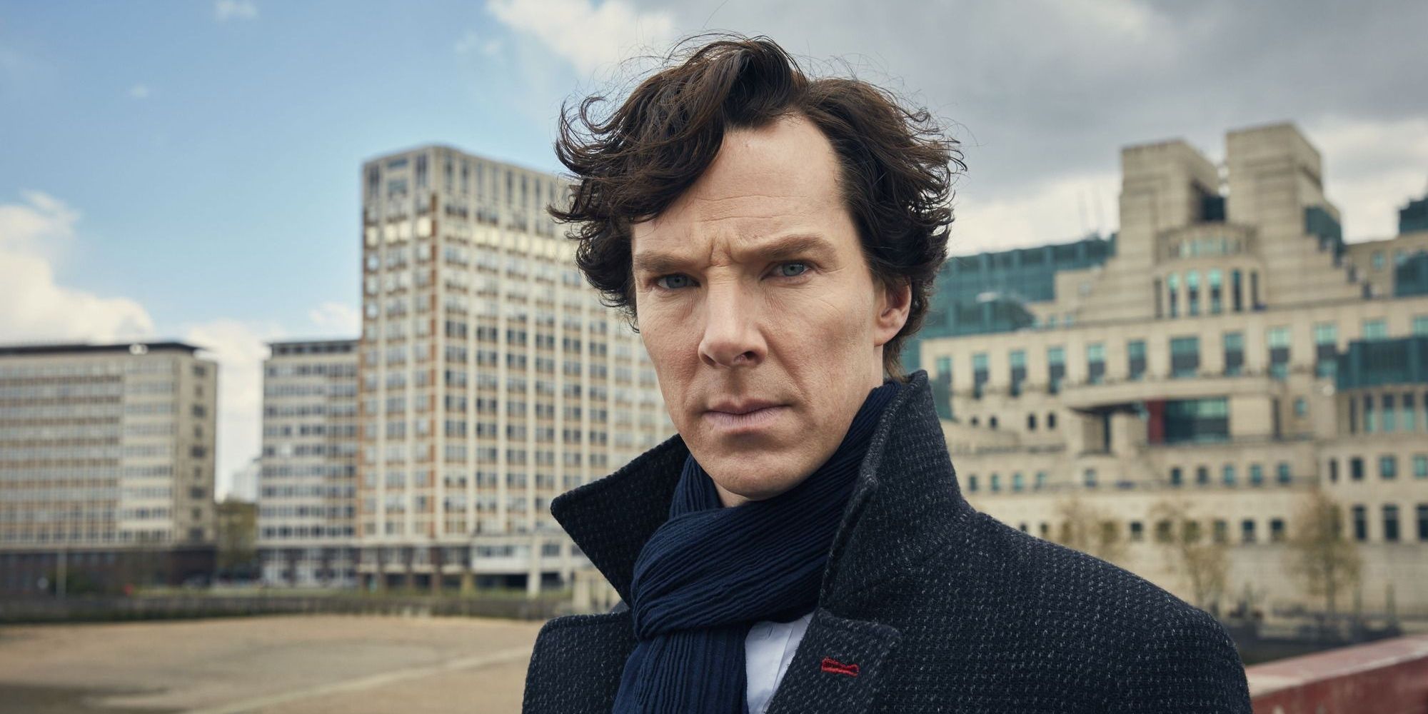 Sherlock Holmes (Benedict Cumberbatch) walks over the Themes in London, in front of the SIS or MI6 Building