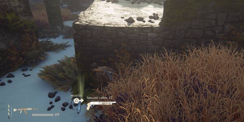 Nathan picking up a Spezzotti shotgun uncharted 4