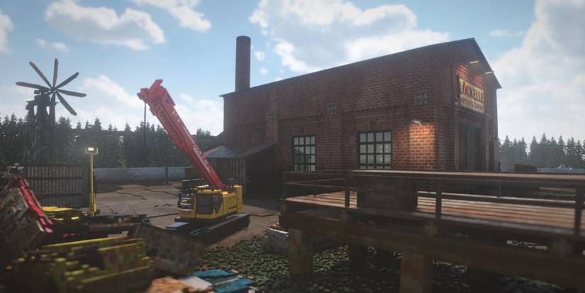 Teardown - A crane parked next to a building.