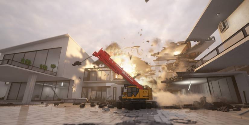 Teardown - A picture of a crane next to a burning building.