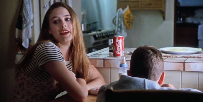 Alicia Silverstone sitting with a young boy in The Babysitter