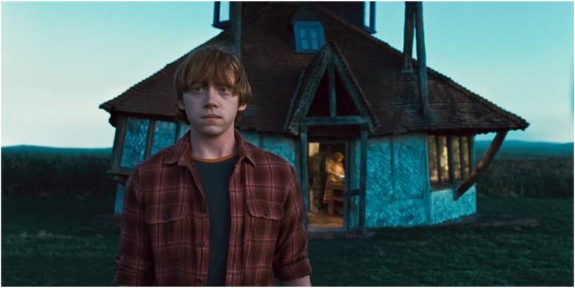 The Burrow In Harry Potter With Ron Weasley And Molly Weasley In The Background