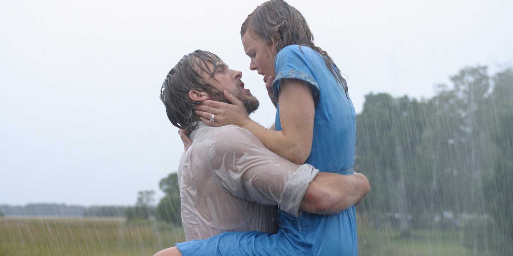 The main characters of The Notebook hugging in the rain