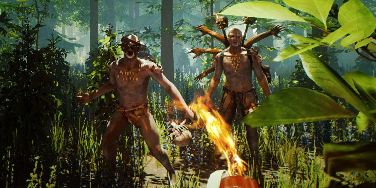 Two cannibals, one with a headdress made of human arms and skulls, confront the player in the survival game The Forest