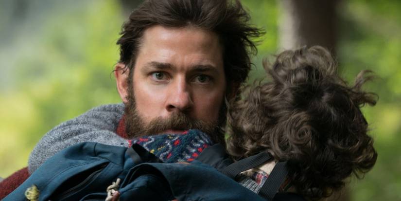 Lee holding Marcus in A Quiet Place