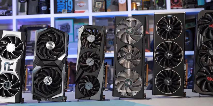 Photo showing a series of AMD and Nvidia graphics cards stood on their ends in a line.