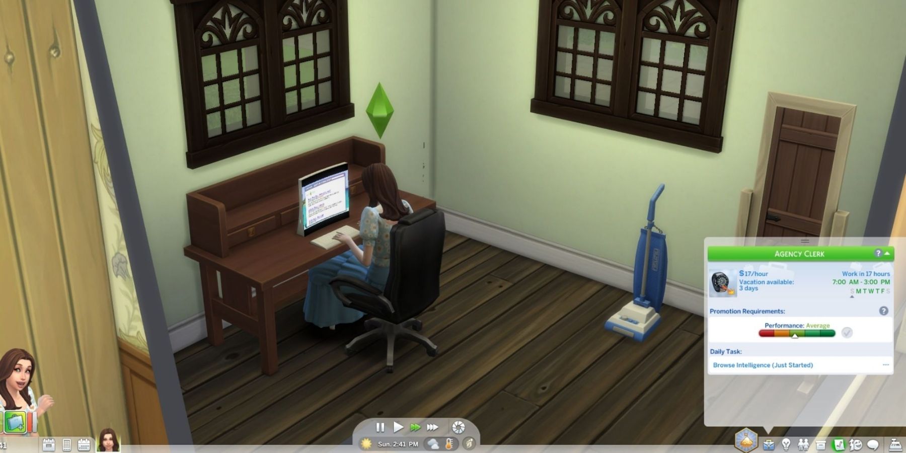 female sim working on a PC in the sims 4