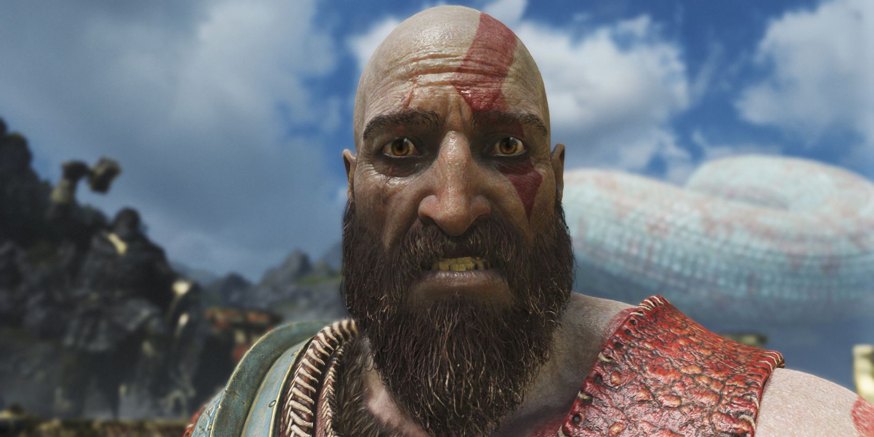 Screenshot from God of War showing a close up of a very worried Kratos.