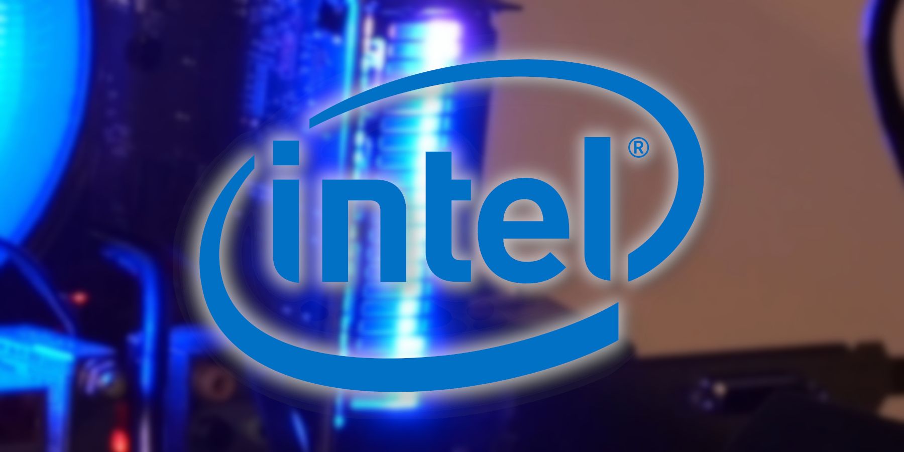 The Intel logo with a blurry image of an Arc GPU in the background.